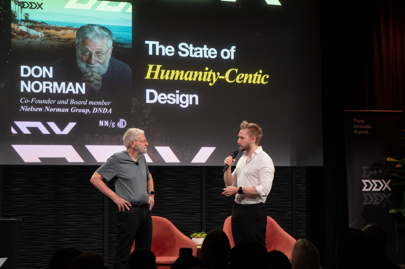 Don Norman in conversation with Sebastian Gier on the Guggenheim stage, slide reading The State of Humanity-Centric Design