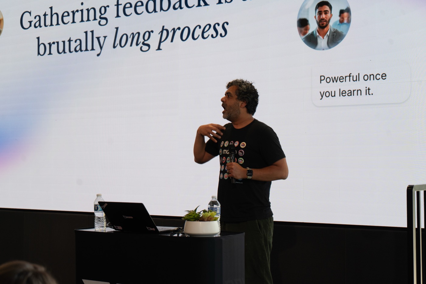 Prayag Narula presenting, slide reading Gathering feedback is a brutally long process